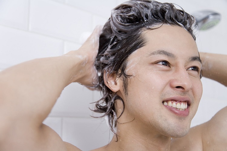 Young Man Washing Hair