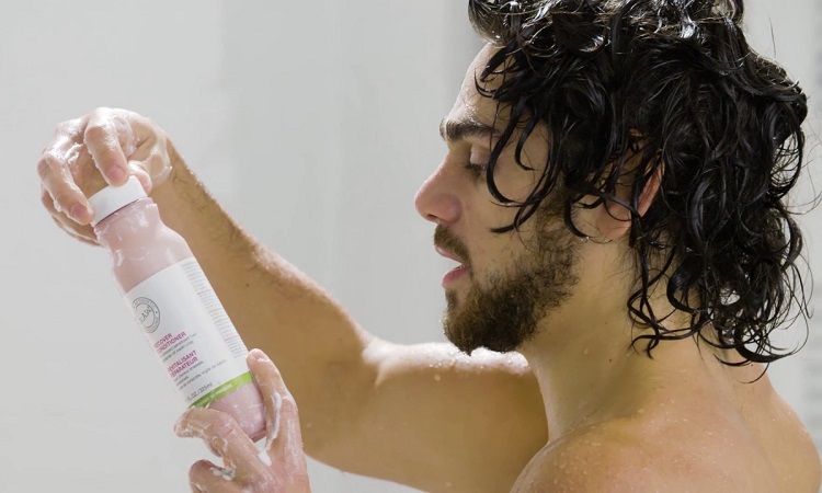 Man Using Hair Conditioner