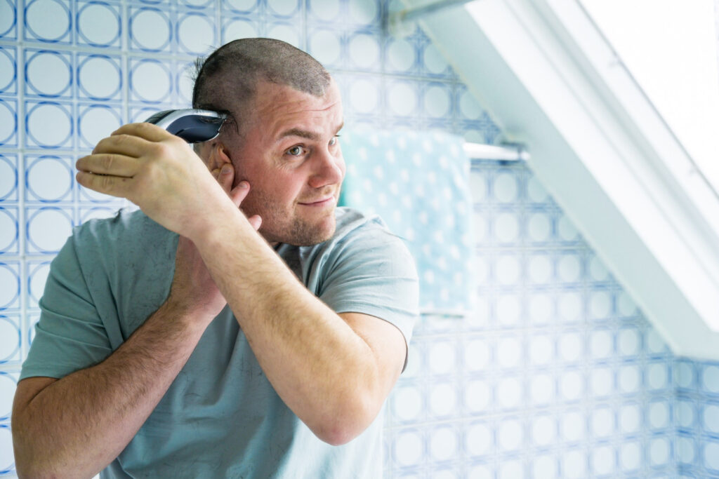 Man shapes hair with the best hair edger