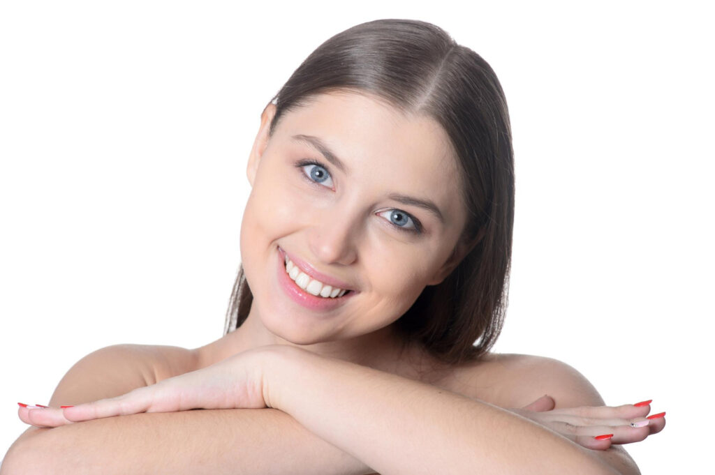 A smiling woman taking care for Fine Hair