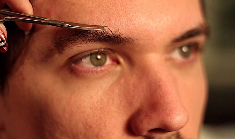 Man Trimming Eyebrow